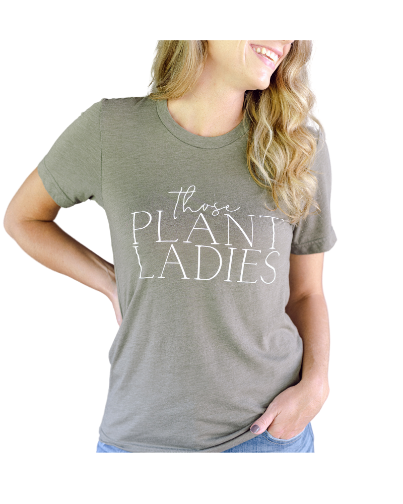 Girl wearing Those Plant Ladies logo tshirt.