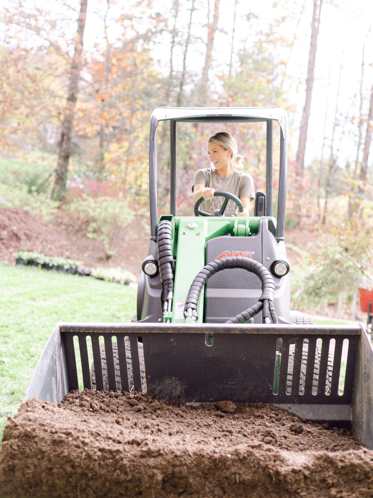 Fawn of Those Plant Ladies driving the Avant Loader 630 at a landscape installation.