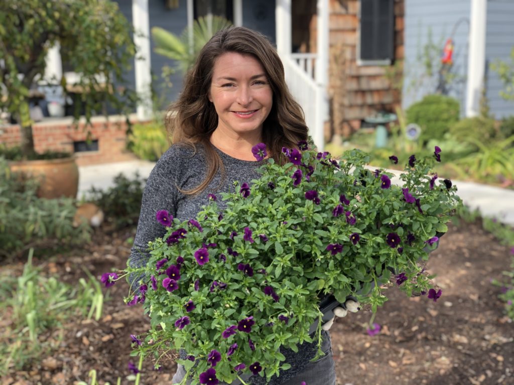 Author Brie Arthur holding flowers.