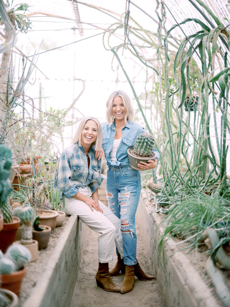 Heather and Fawn of Those Plant Ladies surrounded by plants in California.