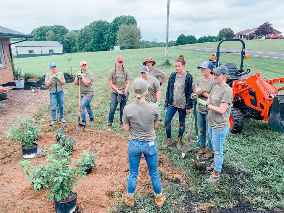 Fawn of Those Plant Ladies leading a crew of women at a landscape installation.