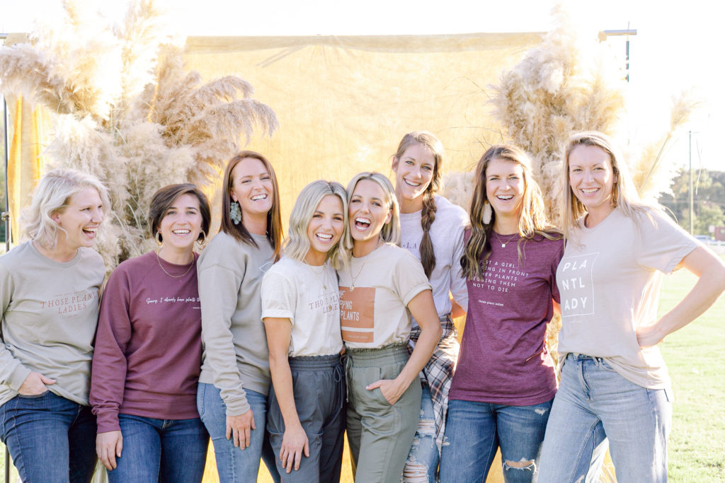 A crew of Those Plant Ladies all in branded tees.