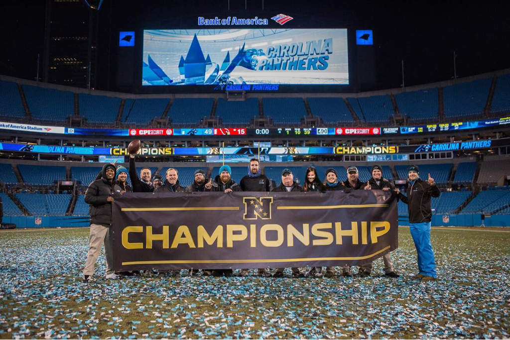 The NFC championship banner with confetti on the field at the Panthers' Stadium.