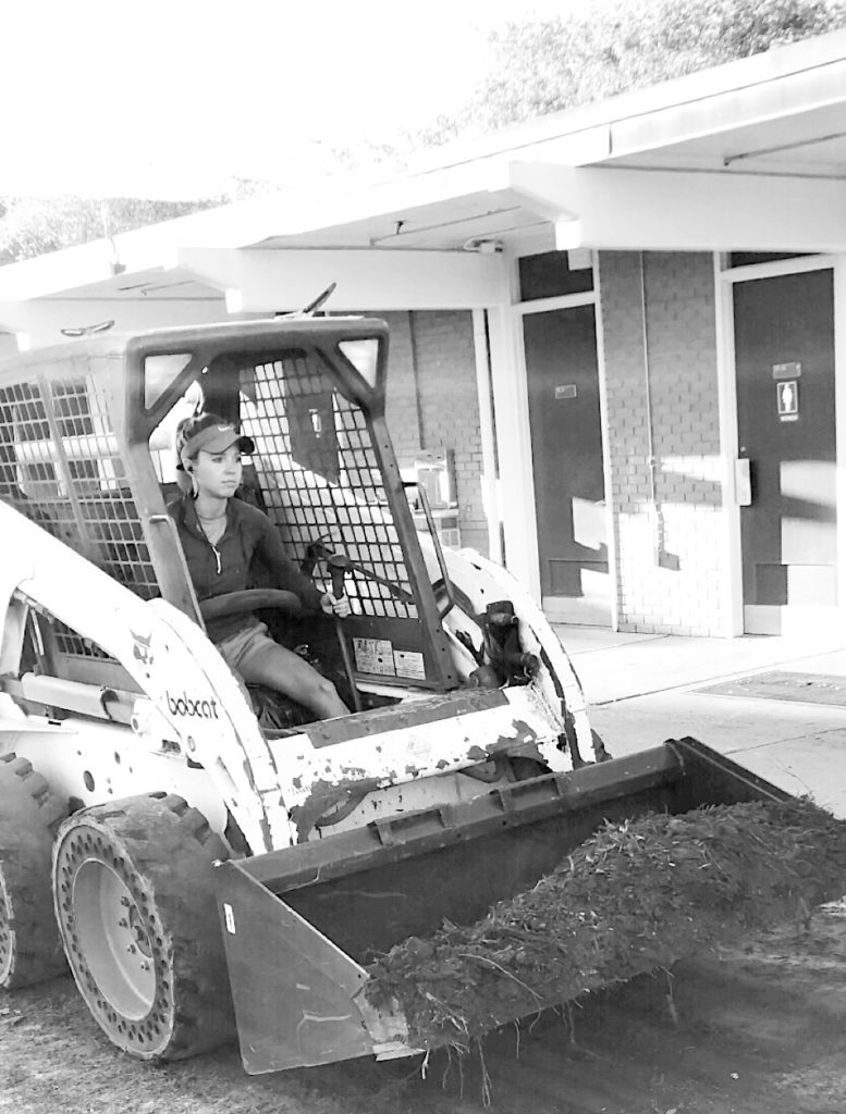 Fawn Wilson driving a bobcat.