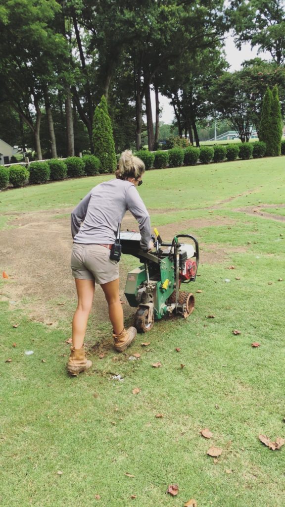 Fawn Wilson of Those Plant Ladies seeding grass.