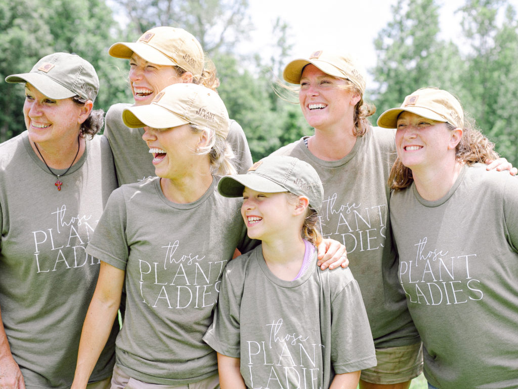 Those Plant Ladies at an installation with their matching tees.