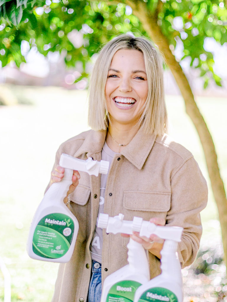 Fawn Wilson of Those Plant Ladies with the Lawnifi bottles from the subscription service.